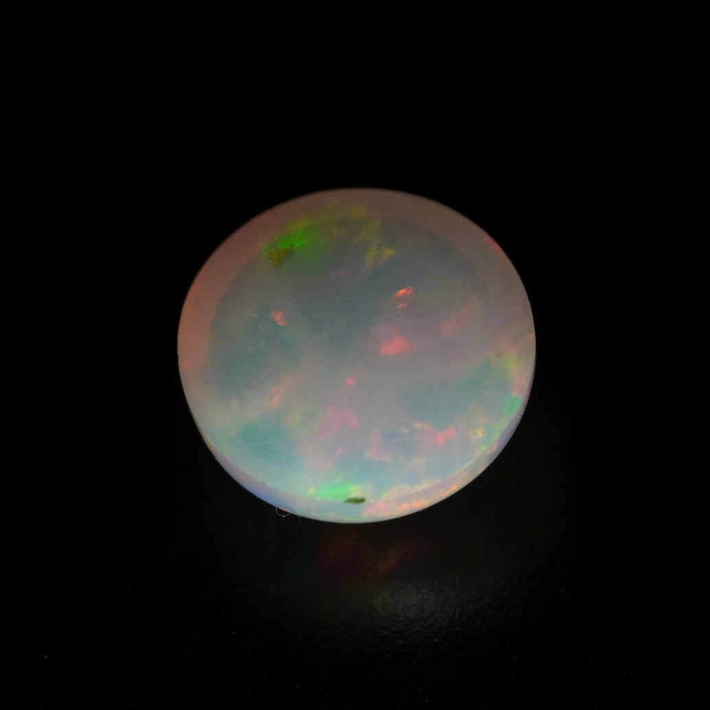 1.03 Karat wunderschöner, runder weißer Welo-Opal - Juvénile Opal